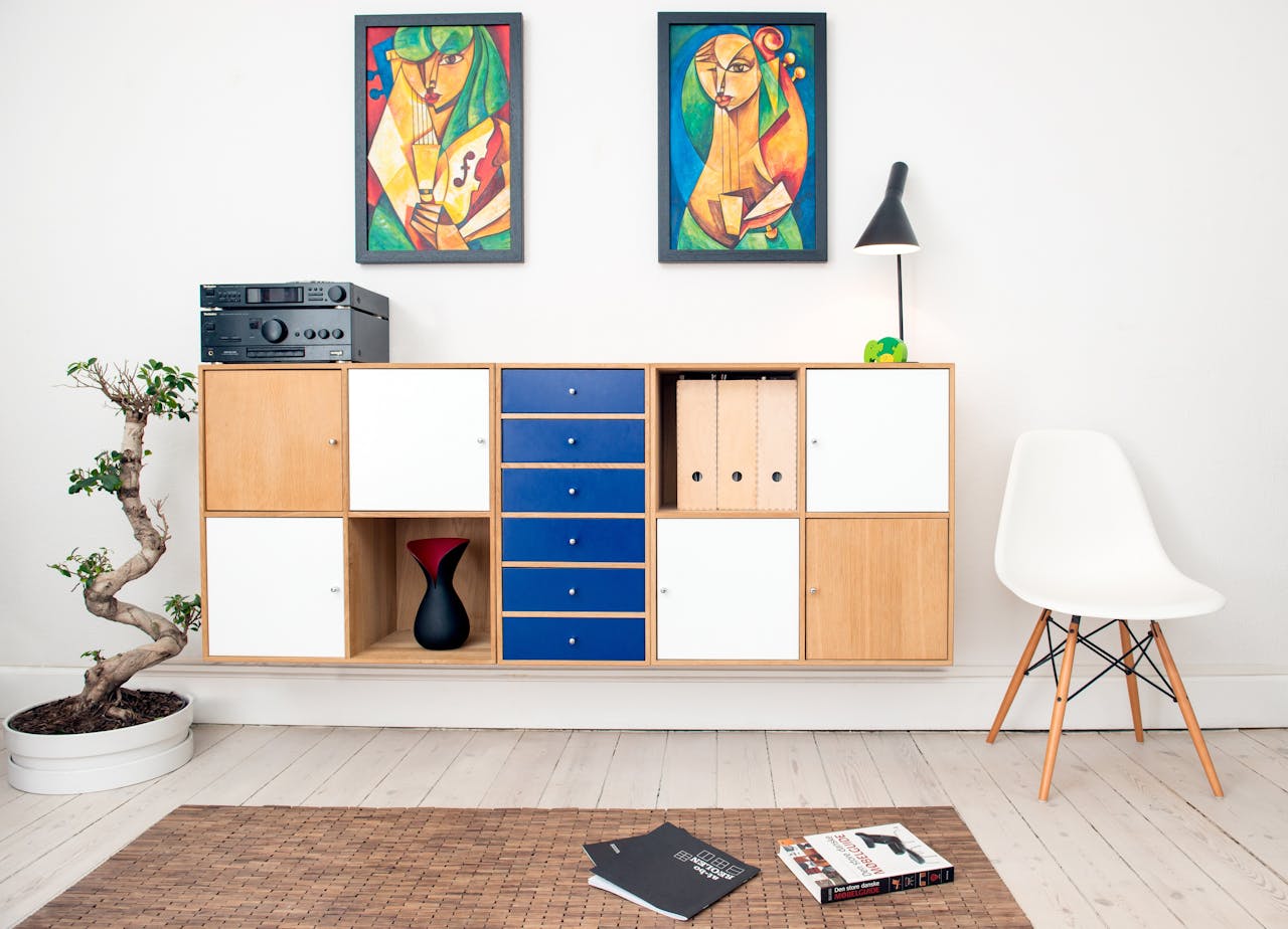 Home Contemporary room design featuring colorful artwork, sleek furniture, and decorative elements.